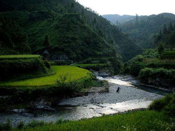 photo of China, Guizhou province, hilly countryside landscape with river close to the Miao village of Xining
