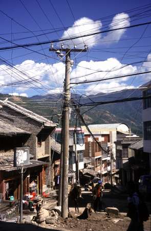 photo of China, Yunnan province, complex electricity wiring in a street in Weixi, a Chinese countryside village close to the border with Tibet