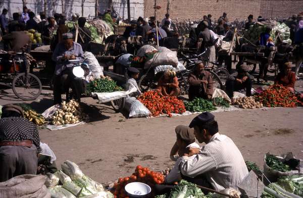 photo of China, Xinjiang province (East Turkistan), Kashi, fruit sellers on the Kashgar Sunday market