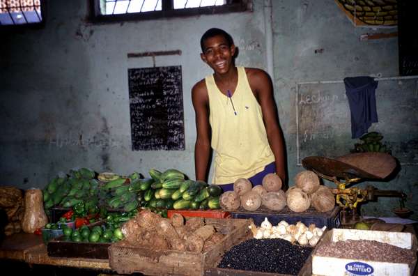 photo of Cuba, fruit seller in a covered market in Havana