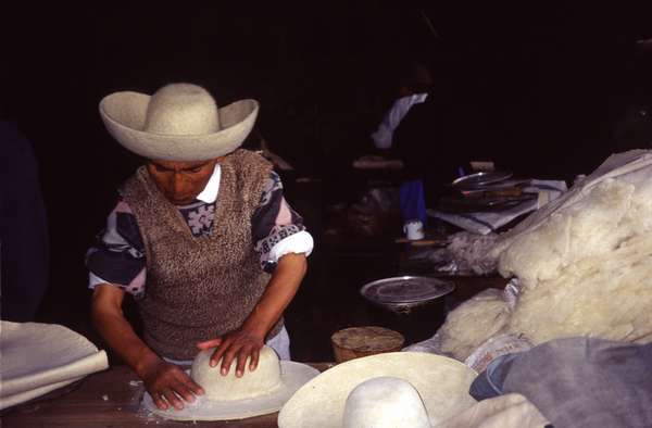 photo of Ecuador, Ecuadorian man making hats in a village in the central highlands