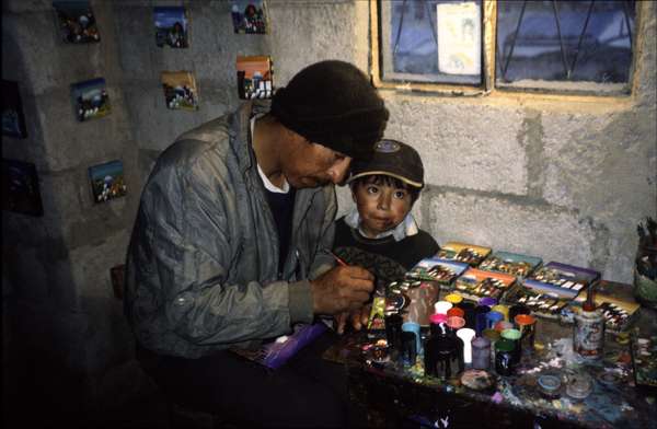 photo of Ecuador, village of Quilotoa, workshop (atelier) of a local artist painting colorful paintings of Andes scenes and the Quilotoa crater lake