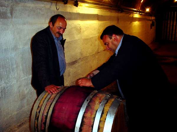 photo of Republic of Georgia, Kakheti province, opening a wine barrel of Green House, a modern Georgian wine making company which stores its wine in the underground tunnel labyrinth in Kvareli