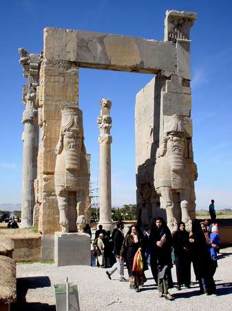 photo of Iran, around Shiraz, women walking out of a gate at Persepolis (Takht-e Jamshid), the ancient capital of Persia