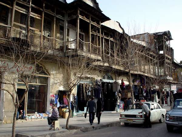 photo of Iran, Shiraz, street with houses with wooden balconies and paykan cars