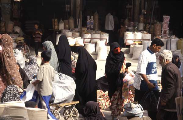 photo of Iran, Persian sea coast, around Bandar Abbas, Thursday market in Minab, women with red burqa masks