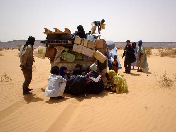 photo of Mauritania, a very typical image of Mauritania : an heavily overloaded Toyota Hilux with a breakdown in the middle of the desert; no fun at 48&deg;C in the shadow and a burning hot and strong Sahara wind which dries you out in no time