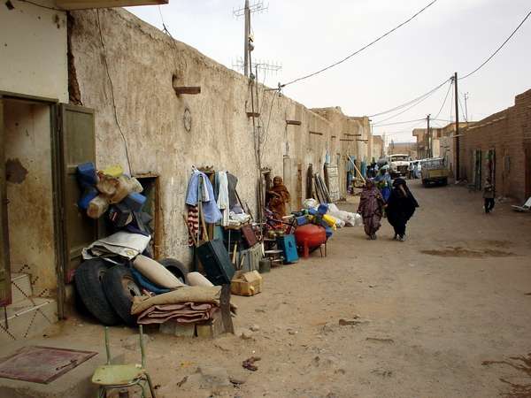 photo of Mauritania, market street with clothes shops in Atar