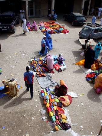 photo of Mauritania, Nouakchott, selling colorful batik fabric on the central market