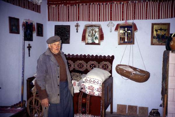 photo of Romania, around Sibiel, village of Funtenele, director showing his tiny ethnographical museum