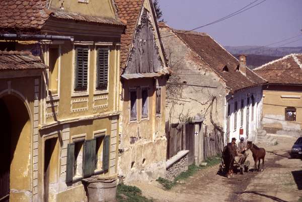 photo of Romania, around Sibiel, street with horse and carriage in the rural village of Funtenele on the countryside of Romania