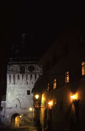 photo of Romania, Transylvania, Sighisoara, inside the citadel, medieval clock tower at night