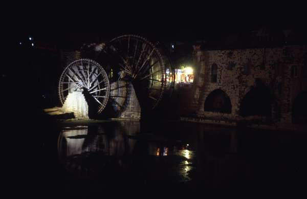 photo of Syria, around Homs, Hama, ancient Norias (waterwheels) on the Orontes River, these old water wheels bring water up from the Orontes for irrigation