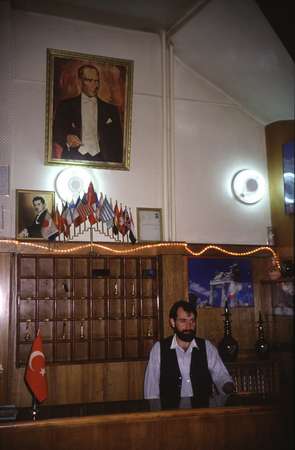 photo of Eastern Turkey, Kars, hotel reception desk with picture of Mustafa Kemal Ataturk (1881-1938), the founder of the Turkish Republic and its first President