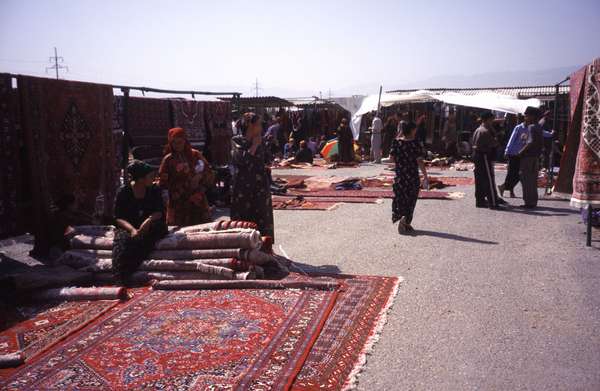 photo of Turkmenistan, around Ashgabat, Turkmen carpet vendors in Tolkuchka bazaar market