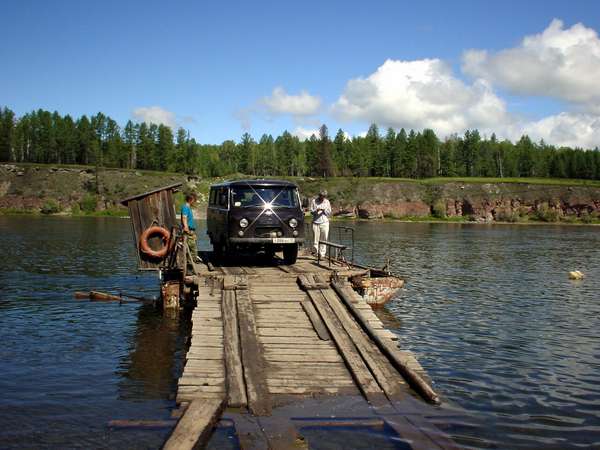photo of Tuva, taiga forest east of Kyzyl, east of Ust Buren on the dirt track to the Old Believers village of Erzey, wooden car ferry crossing a river