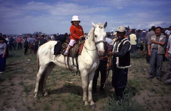 photo of Tuva, around Kyzyl, Dembildei 2002 festival, horse racing competition, Tuvan girl on a white horse