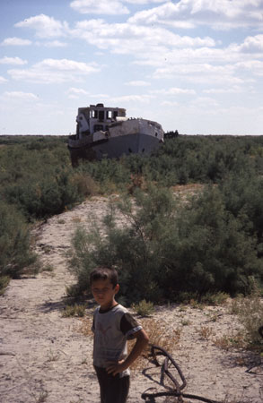 photo of Uzbekistan, around Moynaq (Moynak, Muynak), a former fishing village on the shores of the Aral Sea, shipwreck of an abandoned boat on the dry bottom of the Aral lake, once the 4th biggest lake in the world, now an environmental disaster