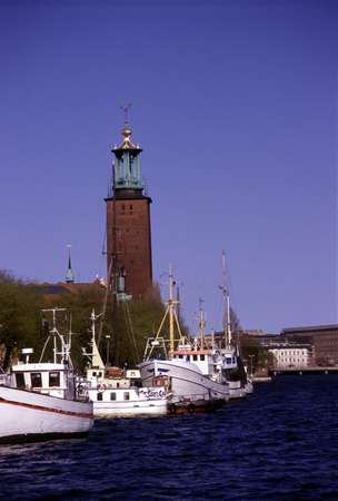 photo of Sweden, Stockholm, boats moored at the City Hall (stadshuset) in Stockholm