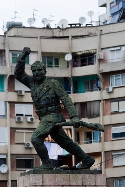 Albania photo of Tirana: Communist Statue of the Unknown Partisan waving his comrades into battle with one hand and his rifle in the other. 