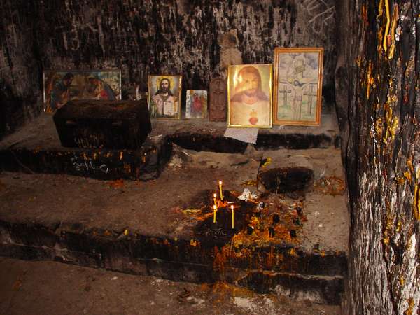 photo of Central Armenia, Ararat region, Khor Virap monastery church, candles and icons in the underground chamber where St. Gregory the Illuminator was imprisoned