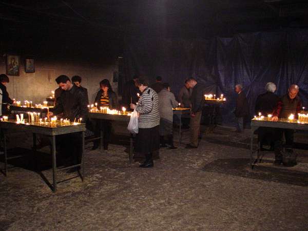 photo of Central Armenia, lighting candles in the cellar of the enormous and new (2001) Grigor Lusavorich National Cathedral in Yerevan