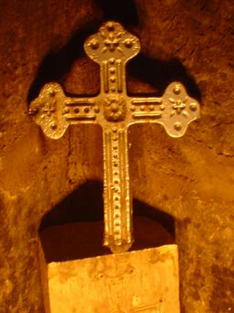 photo of Armenia, cross lightened by candles in Armenian church