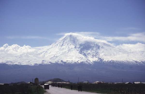photo of Central Armenia, south of Yerevan, view of the holy Ararat mountain (5165m), rising up from Turkey above a village along the road to the Khor Virap monastery