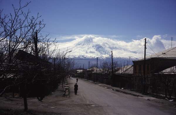 photo of Central Armenia, south of Yerevan, view of the holy Ararat mountain (5165m), rising up from Turkey above a village along the road to the Khor Virap monastery