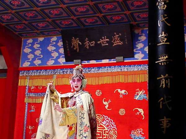 photo of China, Beijing (Peking, Pekin), traditional Chinese opera in Zheng-Yi temple theatre, an old wooden opera house in one of the hutongs close to the Forbidden City