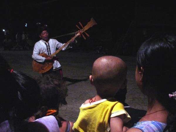 photo of China, Guanxi province, traditional musician in a Dong village