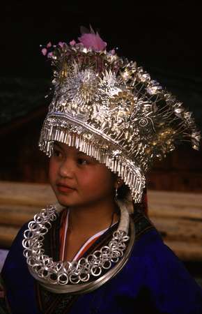 photo of China, Guizhou province, Miao girl of folklore group in traditional ethnic Miao costume