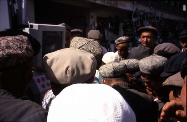 photo of China, Xinjiang province (East Turkestan), Kashi, Uygur men and a computer on the Kashgar Sunday market