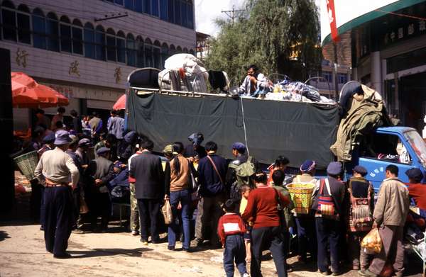 photo of China, Yunnan province, sales from a truck on the market of the rural village Weixi