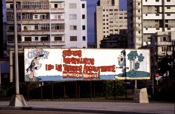 photo of Cuba, propaganda billboard along the seafront in Havana with Uncle Sam growling at a proud Cuban  : 'Senores imperialistas, no les tenemos absolutamente ningun miedo' (gentlemen imperialists, we are absolutely not scared of you !)