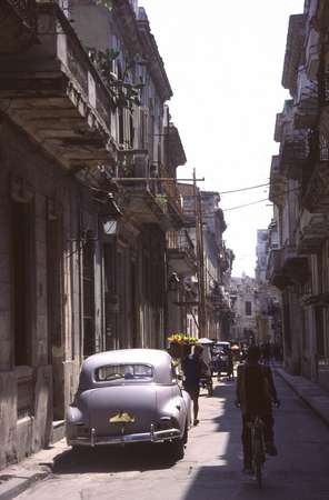 photo of Cuba, street in Havana Old Town with Cuban American oldtimer