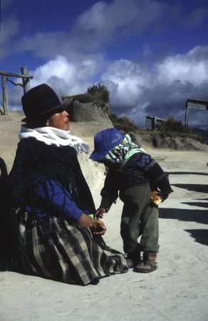 photo of Ecuador, Andes, Quilotoa village, highland Quechua indian woman and her child on the border of the crater lake of Quilotoa