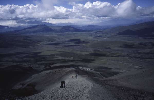 photo of Ecuador, Andes, panoramic view from high up (around 4800 m) the Cotopaxi volcano (5897 m). Fortunately for less trained humans you can drive up to a parking on 4500 m and walk on from there to a mountain station