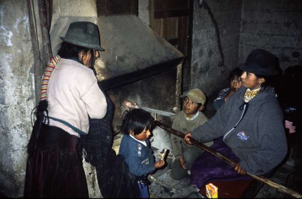 photo of Ecuador, Andes, Quilotoa, Andean Indian family preparing Cuy (Guinea pig) in the open fire