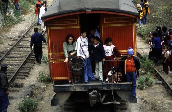 photo of Last wagon carriage of the Riobamba train at the Nariz del Diablo (devil's nose), a vertical rock connecting the coast with the Andean plateau. To traverse this diabolical cliff, the engineers had to build a zigzagging rail line which climbed 800 meters in 2 kilometers