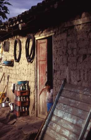 photo of Ecuador, Andes highlands, Andean child and house