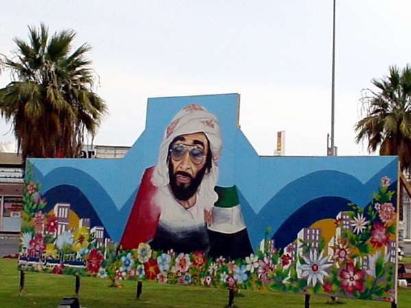 photo of United Arab Emirates, Fujairah, billboard of His Highness Sheikh Zayed bin Sultan Al Nahyan with sunglasses