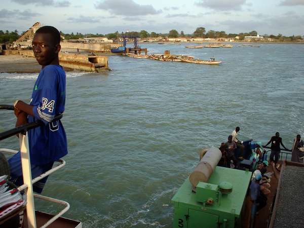 photo of Gambia, leaving of the ferry boat crossing the Gambia river from Barra to Banjul, the Gambian capital