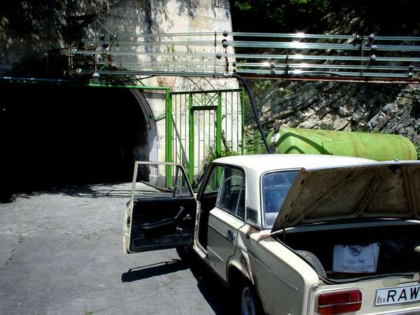 photo of Republic of Georgia, Kakheti province, Kvareli, Zhiguli at the entrance of the underground tunnel complex cut out in a mountain for storage of wine at ideal temperatures