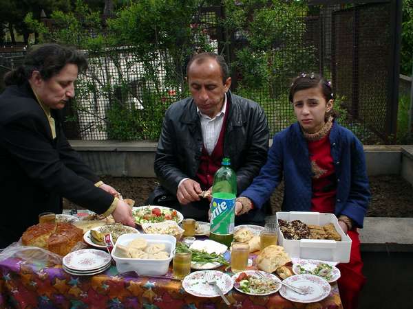 photo of Republic of Georgia, graveyard around Tbilisi, commemorating the death on Georgian (orhodox) eastern monday, following their traditions, Georgians have a huge meal next to the family graves and toast with wine on the death