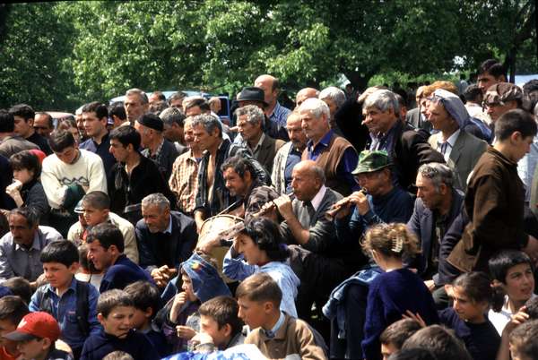 photo of Republic of Georgia, Georgian men watching a wrestling competition on Kochioba, a celebration in a small village in Kakheti