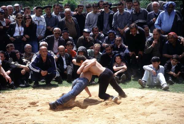 photo of Republic of Georgia, Georgian men watching a wrestling competition on Kochioba, a celebration in a small village in Kakheti