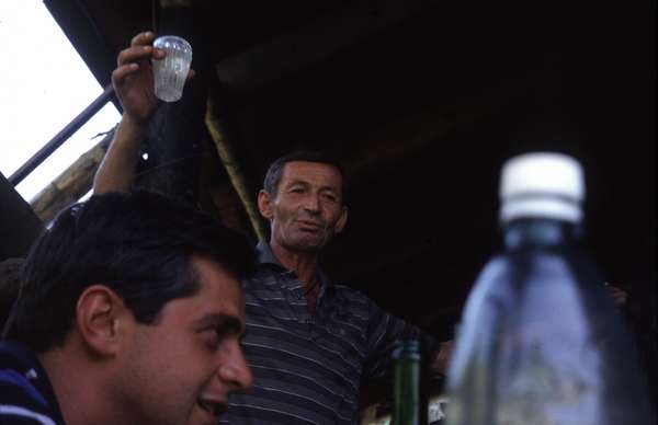 photo of Republic of Georgia, toasting with wine on a keipe in Svaneti