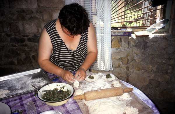 photo of Republic of Georgia, Kutaisi, preparation of Khinkali, delicious Georgian dumplings