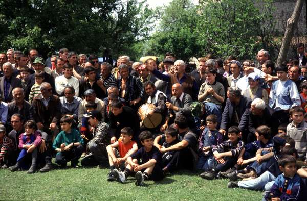 photo of Republic of Georgia, Kakheti, Kochioba festival, crowd with musiscians watching a wrestling competition